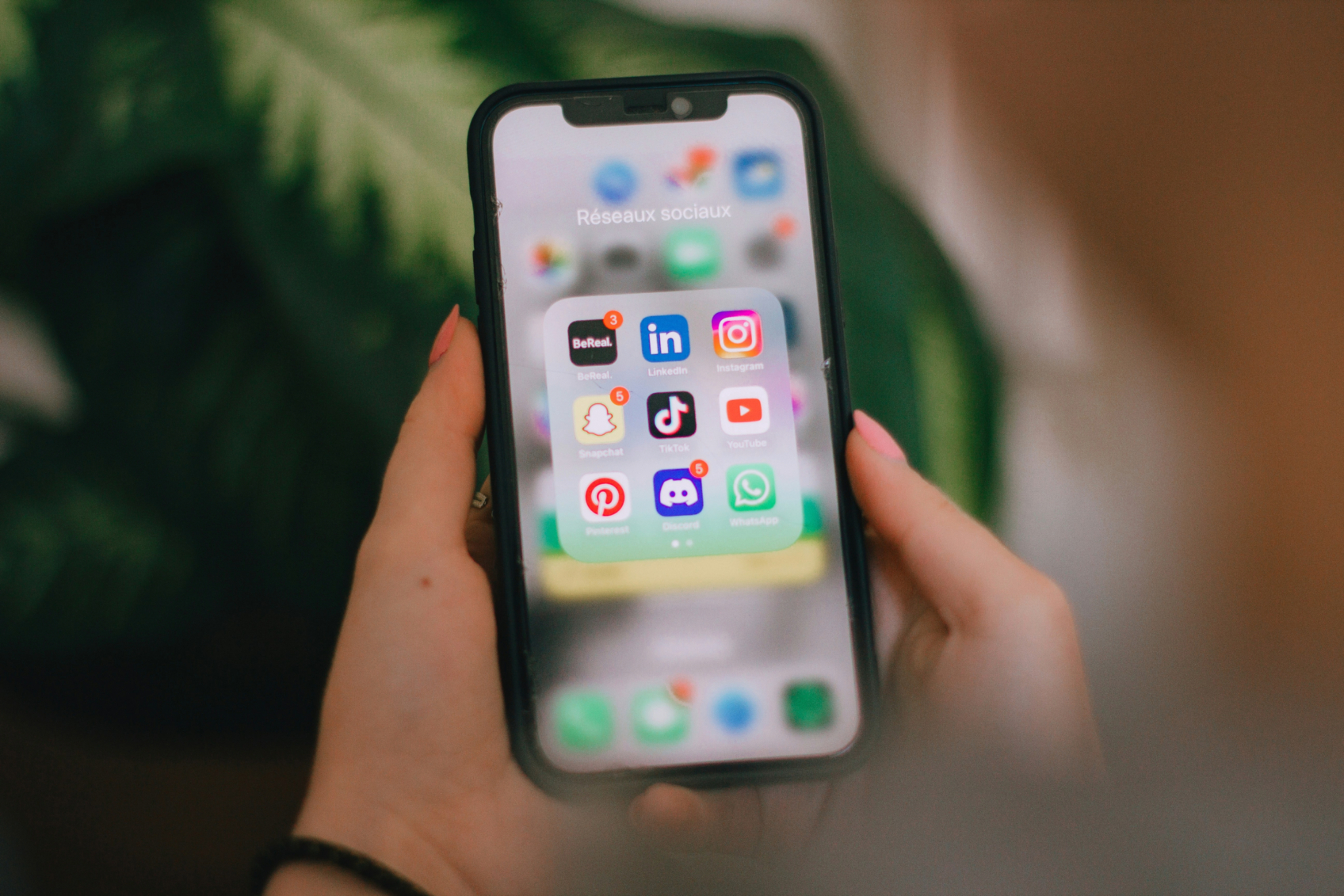An iphone homescreen displaying social media apps